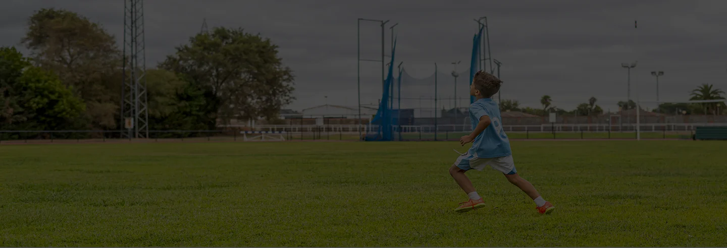 Young athlete training with coach